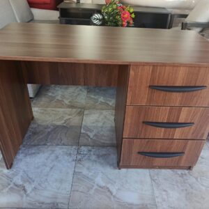 Brown desk with three drawers